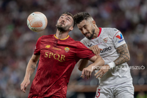 Bryan Cristante of Roma competes for the ball with Alex Telles of Sevilla during the UEFA Europa League final at Puskás Aréna on May 31, 2023 in Budapest, Hungary.