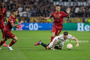 Lucas Ocampos of Sevilla competes for the ball with Lorenzo Pellegrini of Roma during the UEFA Europa League final at Puskás Aréna on May 31, 2023 in Budapest, Hungary.