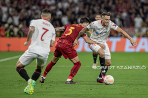 Lucas Ocampos of Sevilla competes for the ball with Roger Ibañez of Roma during the UEFA Europa League final at Puskás Aréna on May 31, 2023 in Budapest, Hungary.
