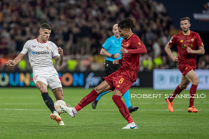 Erik Lamela of Sevilla competes for the ball with Chris Smalling of Roma during the UEFA Europa League final at Puskás Aréna on May 31, 2023 in Budapest, Hungary.
