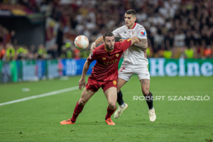 Bryan Cristante of Roma competes for the ball with Erik Lamela of Sevilla during the UEFA Europa League final at Puskás Aréna on May 31, 2023 in Budapest, Hungary.
