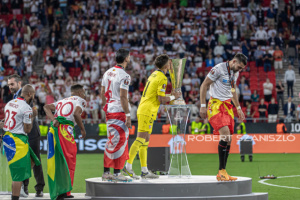 Alberto Flores of Sevilla kiss the trophy on the podium aftre the UEFA Europa League final at Puskás Aréna on May 31, 2023 in Budapest, Hungary.
