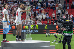 Loïc Badé of Sevilla takes a selfie with the trophy on the podium aftre the UEFA Europa League final at Puskás Aréna on May 31, 2023 in Budapest, Hungary.

