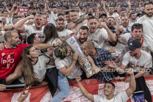 Sevilla's fans kiss the trophy after the UEFA Europa League final at Puskás Aréna on May 31, 2023 in Budapest, Hungary.