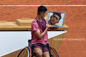 Tokito Oda enjoy the podium with his trophy after the Men’s Wheelchair Singles final at Roland Garros Grand Slam Tournament - Day 14 on June 10, 2023 in Paris, France.
