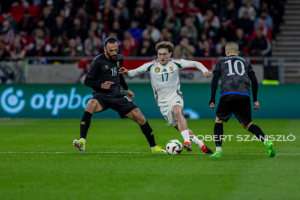 Callum Styles of Hungary competes for the ball with Edon Zhegrova of Kosovo during the friendly match at Puskás Aréna on March 26, 2024 in Budapest, Hungary.